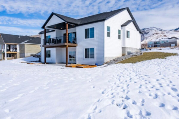 Back and side yard viewpoint of custom built home in boise idaho