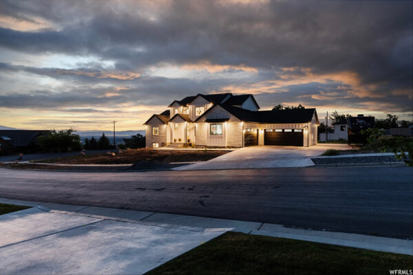 Evening view of front of custom built home by KJ Builders in Boise Idaho