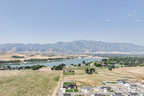 Aerial View of custom built home and surrounding area with beautiful mountain range in Boise Idaho