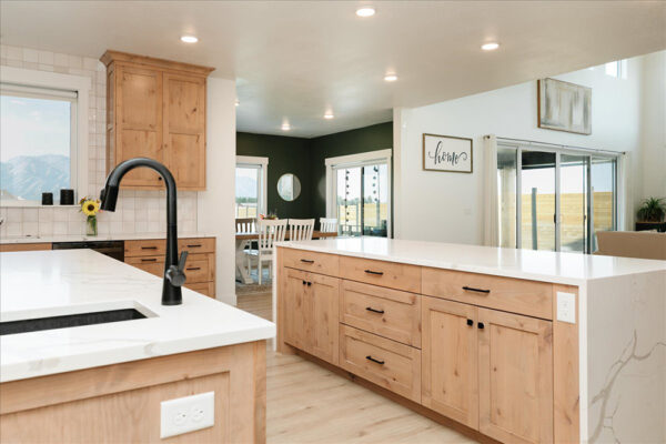 Custom built kitchen with view into dining room and living room based out of Boise Idaho