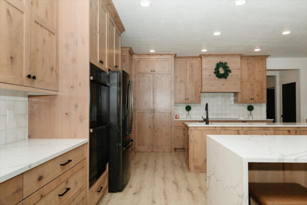 Custom built kitchen with granite counter tops and wooden cabinets in Boise Idaho