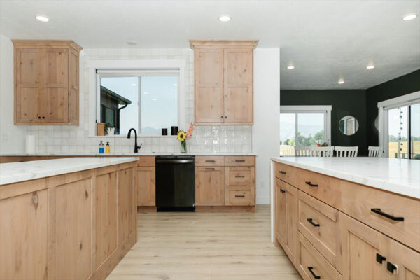 Custom built kitchen with two islands and wood cabinets in Boise Idaho