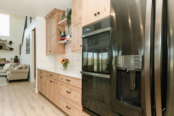 Custom built home with wooden cabinets and two islands by KJ Custom builders in Boise Idaho