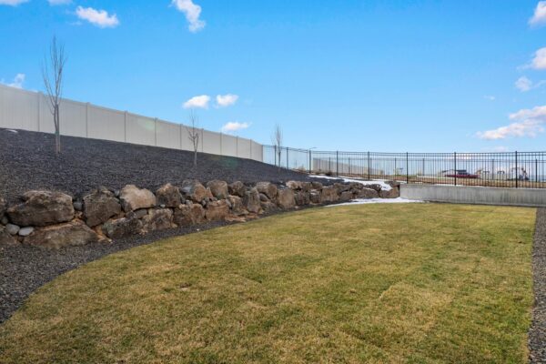 Custom built home backyard full view in residential neighborhood