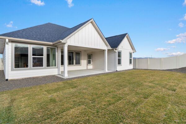 View of custom built home in backyard