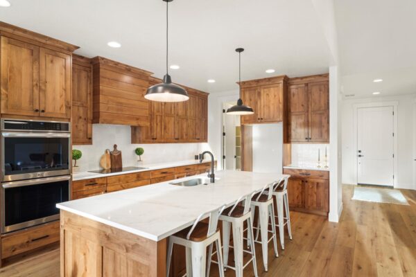 custom built kitchen with wood cabinets corner view with foyer